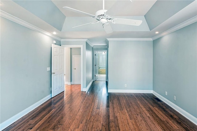 unfurnished room featuring ornamental molding, ceiling fan, and dark wood-type flooring