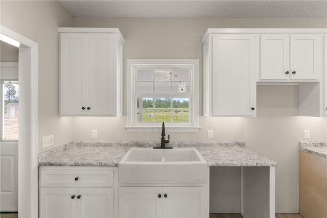 4432 Pembers Rd, Nahunta, GA 31553 - kitchen with white cabinets and light stone counters