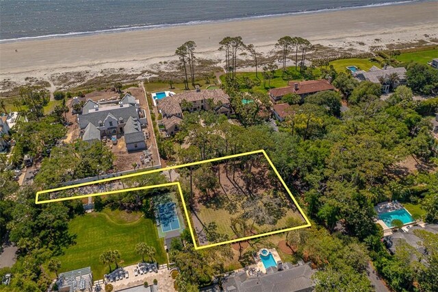 aerial view featuring a water view and a beach view