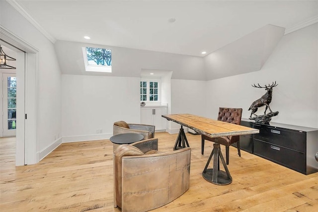 office with light wood-type flooring, crown molding, and vaulted ceiling