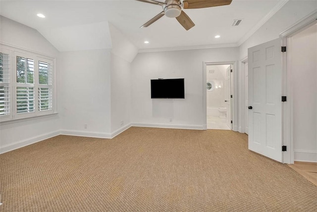 interior space with ceiling fan, light colored carpet, lofted ceiling, and ornamental molding