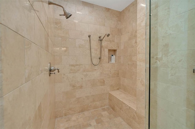 bathroom featuring a tile shower