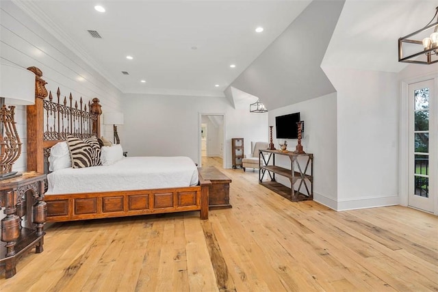 bedroom featuring light hardwood / wood-style floors and ornamental molding