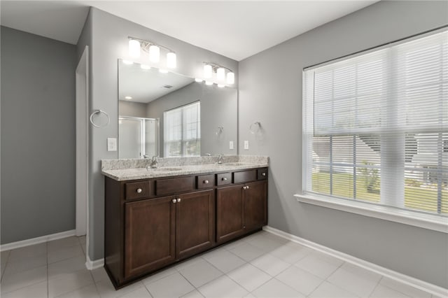 259 Daniel Trent Way, Kingsland, GA 31548 - full bathroom featuring double vanity, a stall shower, and tile patterned flooring