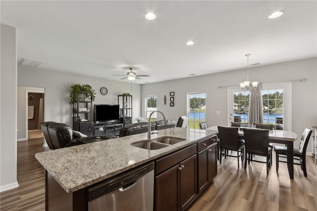 259 Daniel Trent Way, Kingsland, GA 31548 - kitchen featuring stainless steel dishwasher, wood finished floors, pendant lighting, dark brown cabinetry, and ceiling fan