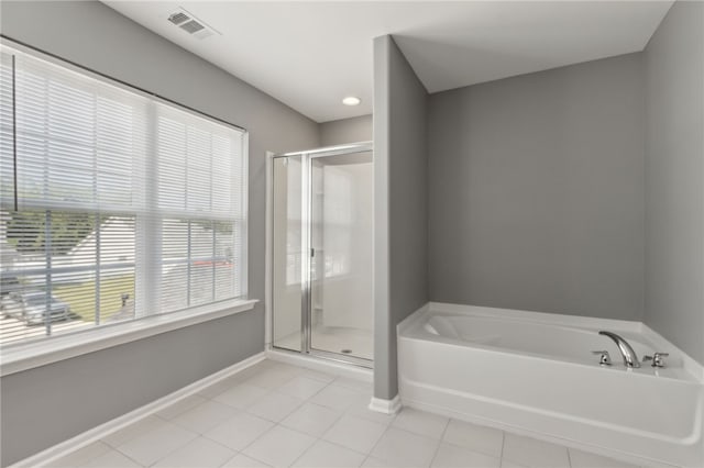 259 Daniel Trent Way, Kingsland, GA 31548 - bathroom featuring a bath, a stall shower, and tile patterned floors