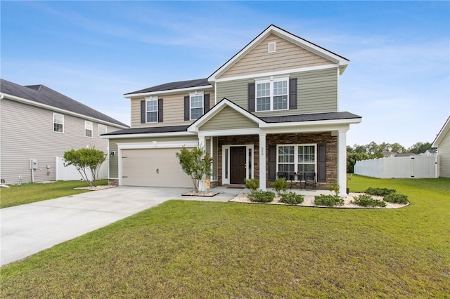 259 Daniel Trent Way, Kingsland, GA 31548 - view of front of house with driveway, covered porch, an attached garage, and stone siding