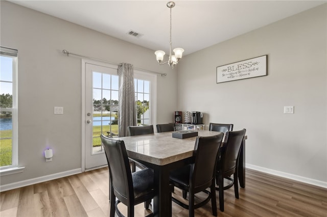 259 Daniel Trent Way, Kingsland, GA 31548 - dining area featuring wood finished floors and a chandelier