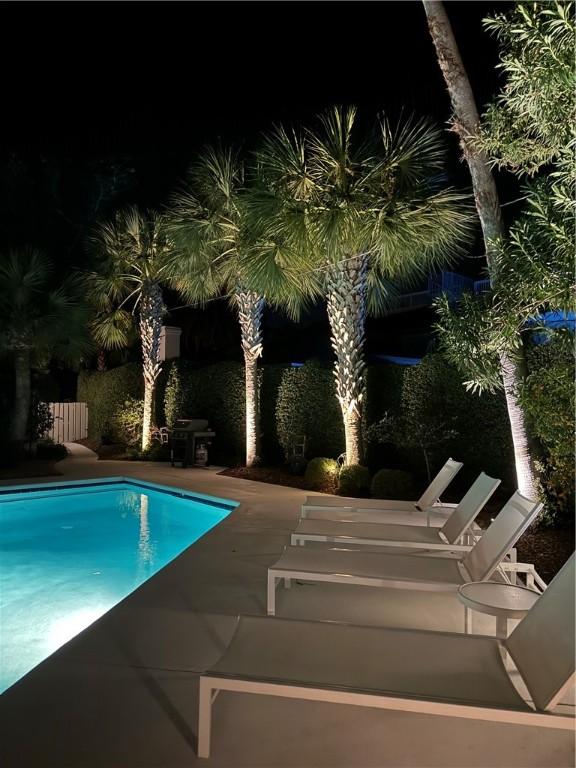 4218 Fifth St, Saint Simons Island, GA 31522 - pool at twilight with an outdoor pool and a patio area