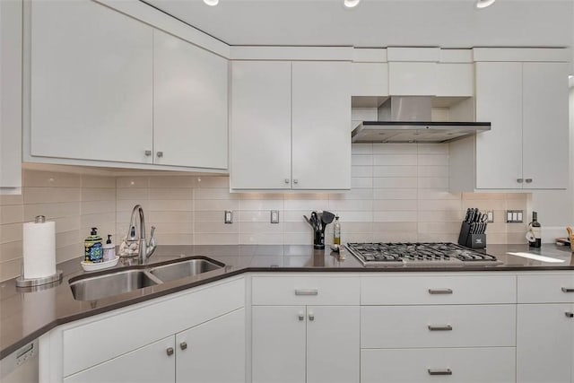 kitchen with wall chimney exhaust hood, dishwashing machine, a sink, and white cabinets