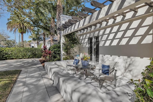 view of patio / terrace with french doors and a pergola