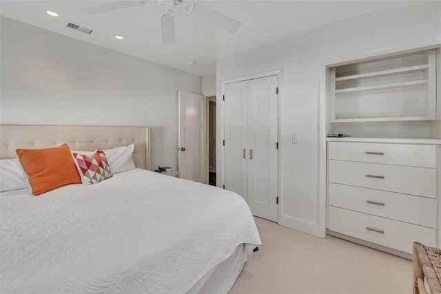 bedroom with visible vents, light colored carpet, ceiling fan, a closet, and recessed lighting