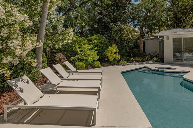 4218 Fifth St, Saint Simons Island, GA 31522 - view of swimming pool with a patio area and a pool with connected hot tub