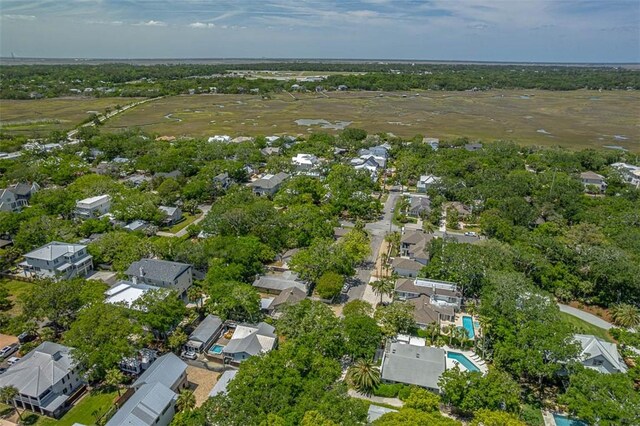4218 Fifth St, Saint Simons Island, GA 31522 - aerial overview of property's location featuring waterfront with a beach, a pool area, and nearby suburban area