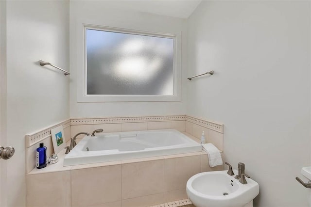 full bathroom with a bidet and a garden tub