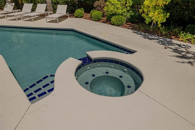 4218 Fifth St, Saint Simons Island, GA 31522 - view of pool with a patio area and a pool with connected hot tub