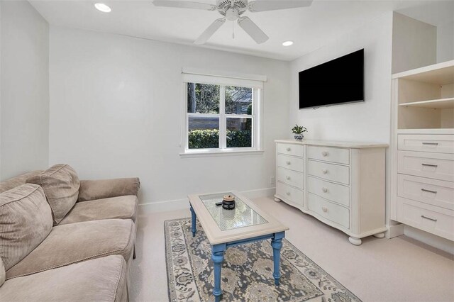 living room with light carpet, baseboards, a ceiling fan, and recessed lighting