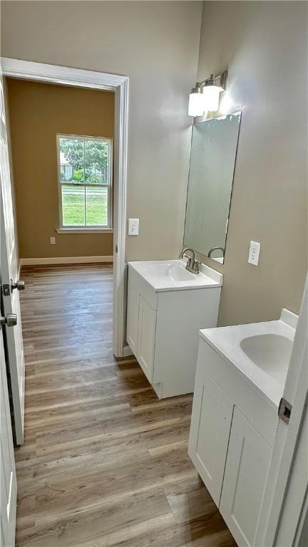 bathroom featuring hardwood / wood-style floors and vanity