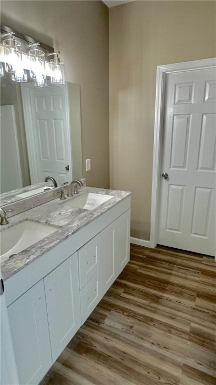 bathroom featuring hardwood / wood-style floors and vanity