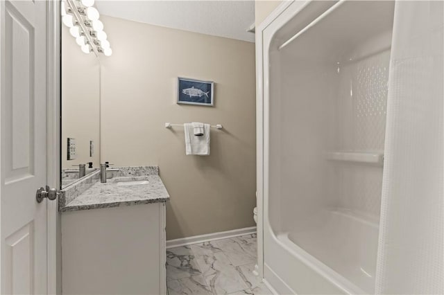 bathroom featuring vanity, a textured ceiling, and toilet