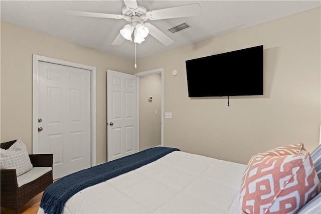 bedroom featuring hardwood / wood-style floors and ceiling fan