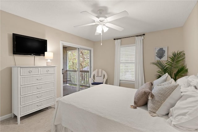 carpeted bedroom with access to outside and ceiling fan