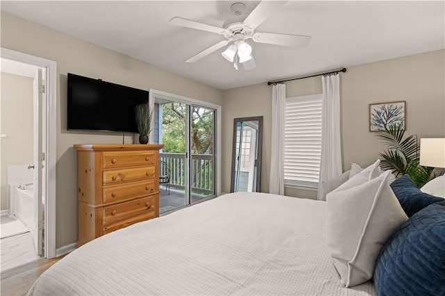 bedroom featuring ceiling fan, wood-type flooring, access to exterior, and connected bathroom