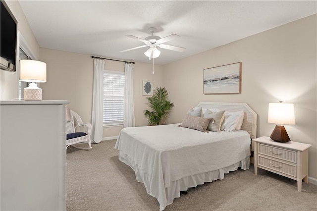 bedroom with light colored carpet and ceiling fan