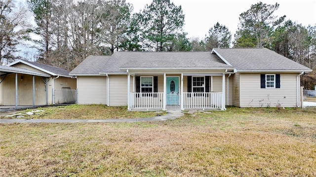 single story home with a front lawn and covered porch