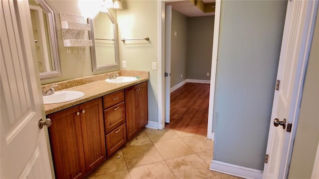 bathroom with tile patterned flooring and vanity