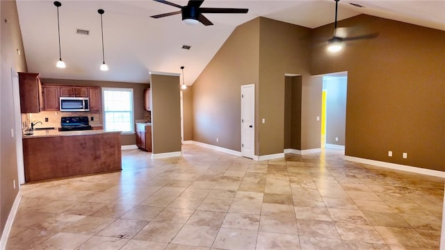 kitchen with high vaulted ceiling, decorative light fixtures, sink, ceiling fan, and black range with electric cooktop