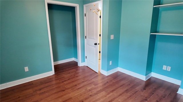 unfurnished room featuring dark hardwood / wood-style floors