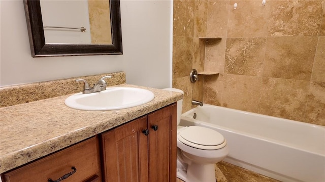 full bathroom with vanity, tiled shower / bath combo, and toilet