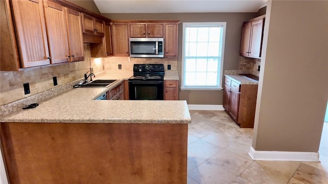 kitchen with black electric range oven, sink, decorative backsplash, kitchen peninsula, and light stone countertops