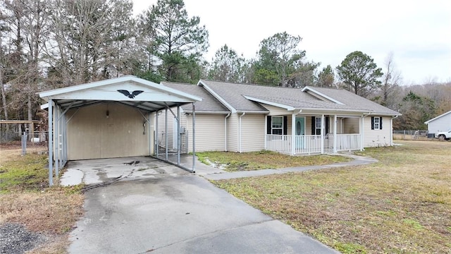 ranch-style home with a front lawn, a carport, and a porch