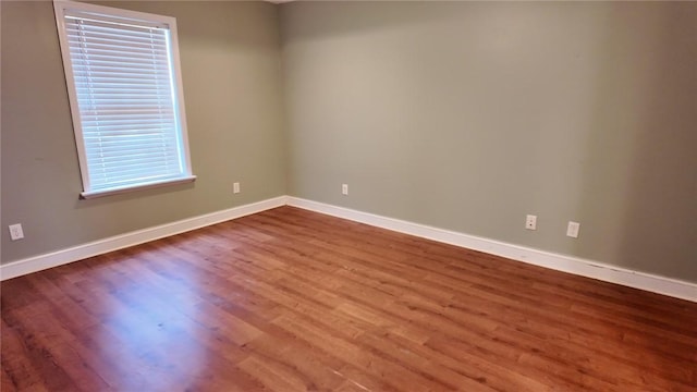 empty room featuring hardwood / wood-style floors