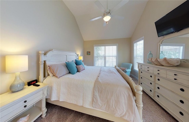 carpeted bedroom featuring ceiling fan and lofted ceiling