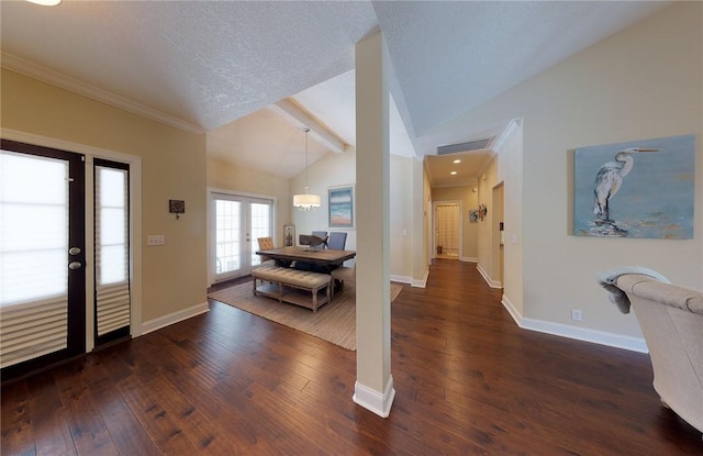 entryway with dark hardwood / wood-style flooring, vaulted ceiling with beams, french doors, and a textured ceiling