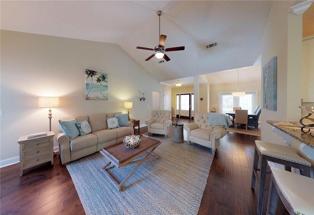 living room featuring high vaulted ceiling, dark wood-type flooring, and ceiling fan