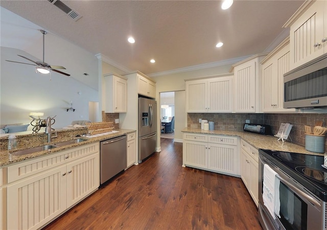 kitchen with tasteful backsplash, sink, dark hardwood / wood-style flooring, stainless steel appliances, and crown molding