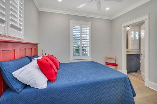 bedroom with baseboards, recessed lighting, ensuite bathroom, crown molding, and light wood-type flooring