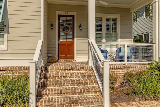 view of exterior entry with a porch