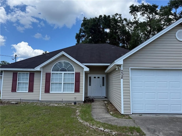 208 Stafford Ave, Brunswick, GA 31520 - ranch-style home with a front lawn and an attached garage