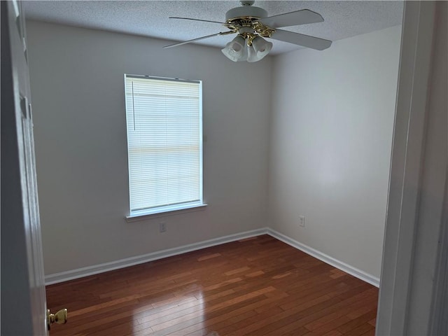 208 Stafford Ave, Brunswick, GA 31520 - unfurnished room featuring dark wood-type flooring, a ceiling fan, healthy amount of natural light, and a textured ceiling