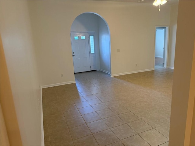 208 Stafford Ave, Brunswick, GA 31520 - tiled empty room featuring arched walkways and ceiling fan