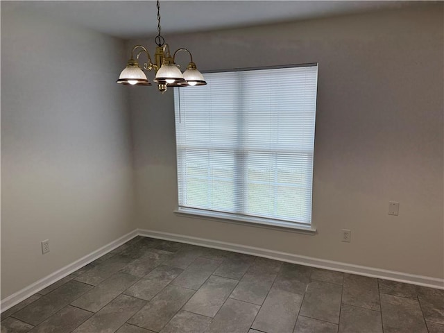 208 Stafford Ave, Brunswick, GA 31520 - unfurnished room featuring a chandelier and baseboards
