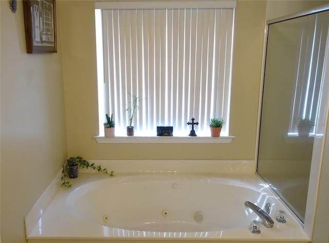 full bath featuring a tub with jets