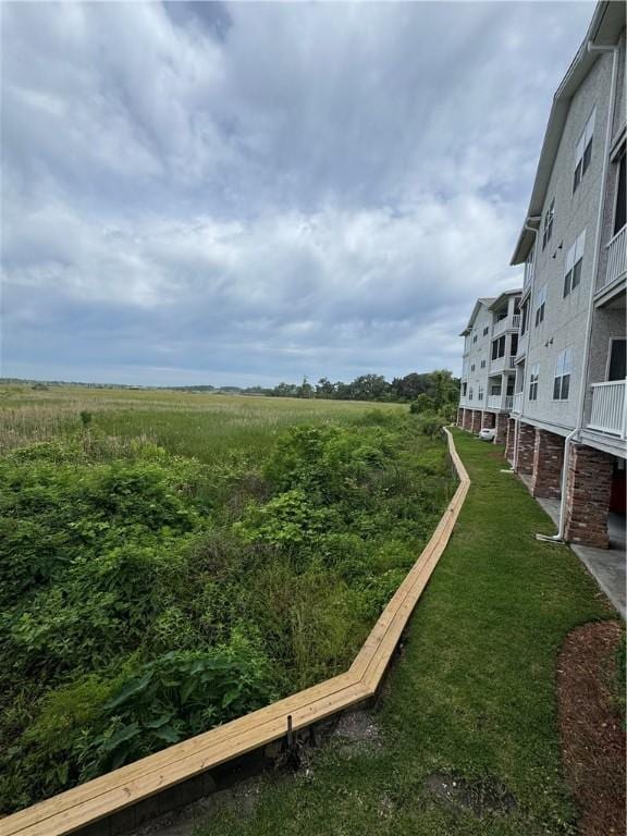 91 Screven St Unit 105, Darien, GA 31305 - view of community with a lawn