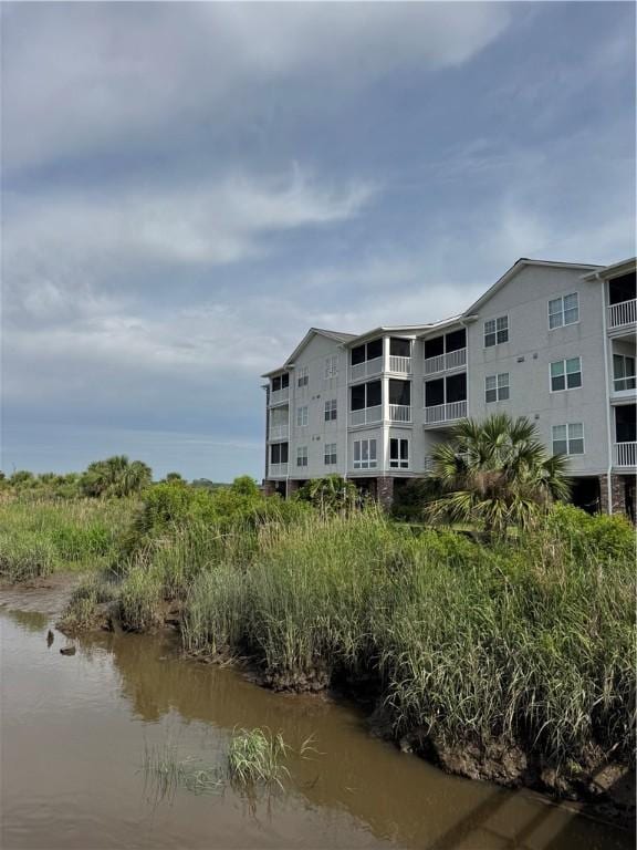 91 Screven St Unit 105, Darien, GA 31305 - view of building exterior with a water view