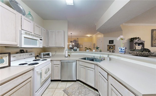 kitchen featuring white appliances, sink, ornamental molding, light tile patterned flooring, and kitchen peninsula